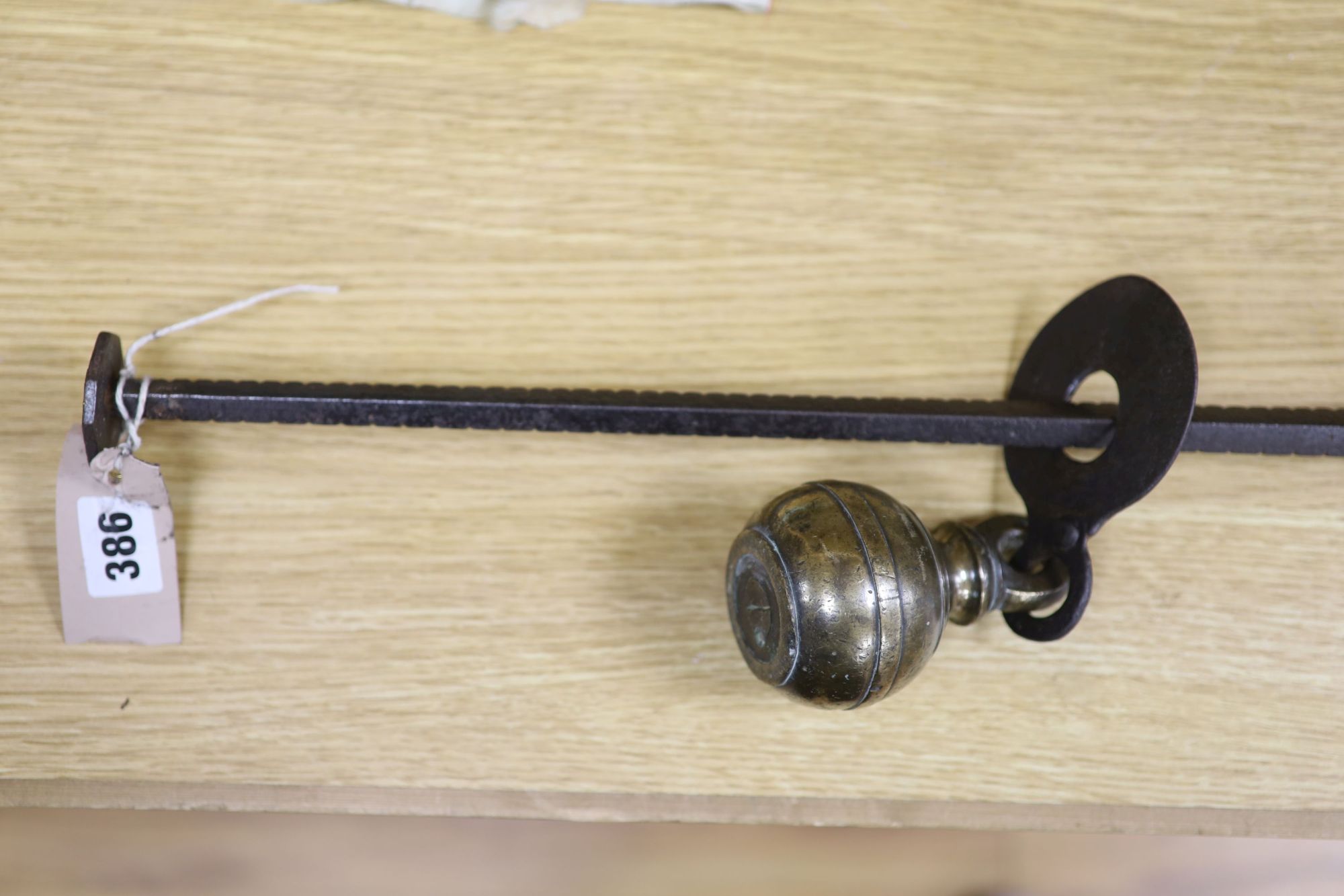 A set of 18th century Italian wrought iron stilliards, with a brass ball weight, length 94cm